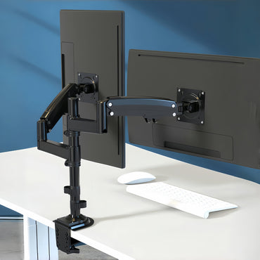 Dual monitor stand with two monitors on a desk against a blue wall.